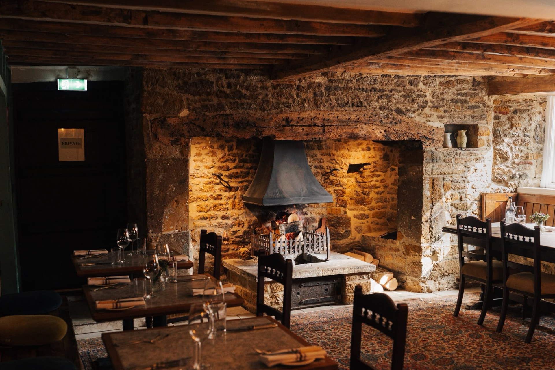The historic stone fireplace in The Duke of Cumberlands Head dining room